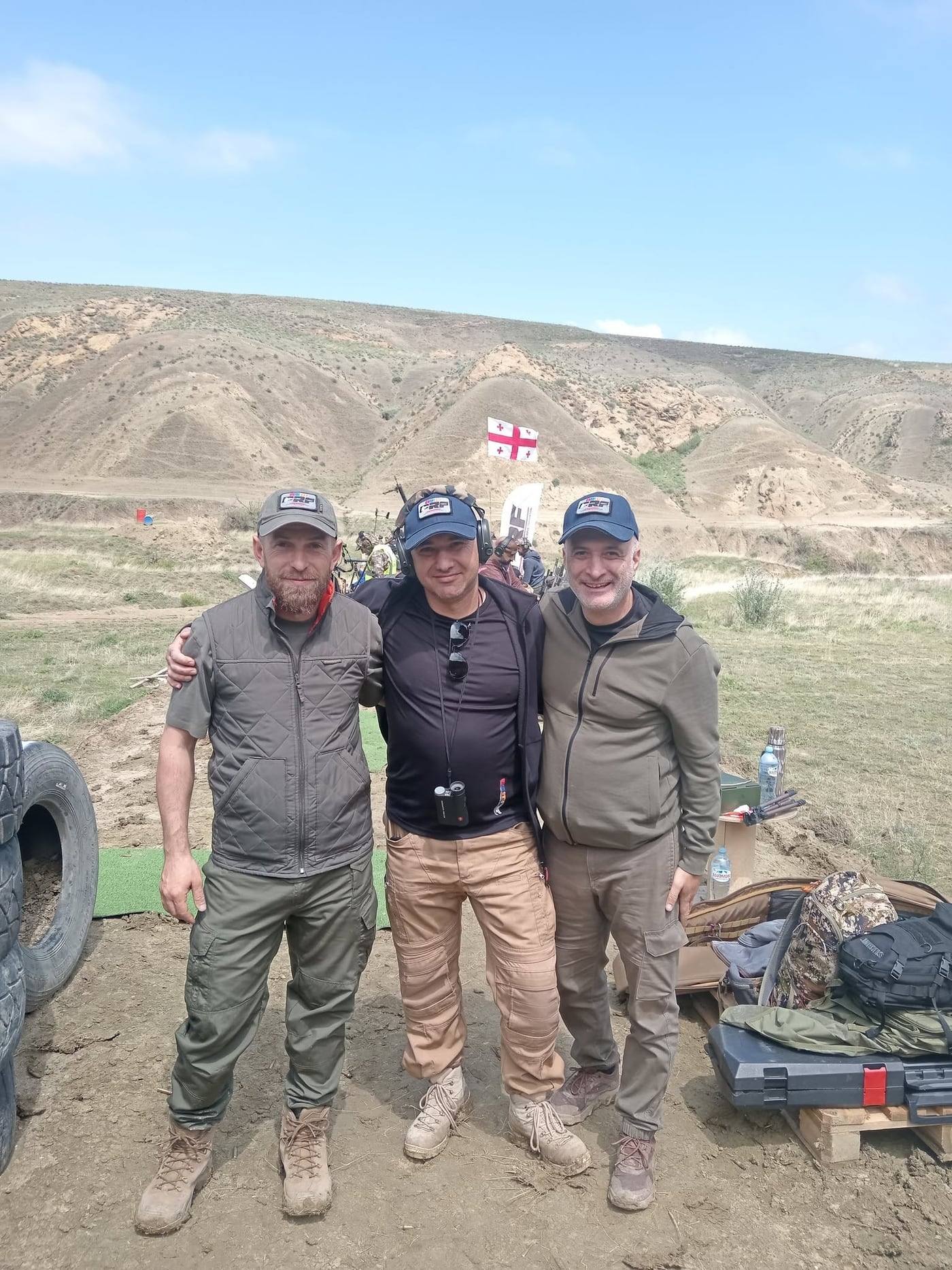 ARMPRF representatives at the match, the Georgian flag flying on the hill