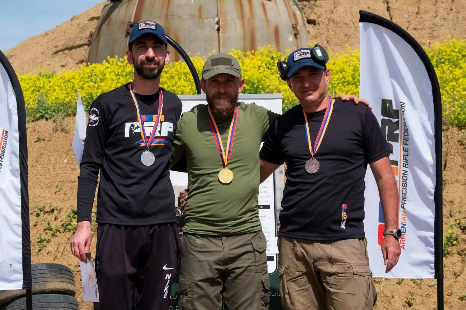 The top three with their medals at the awards