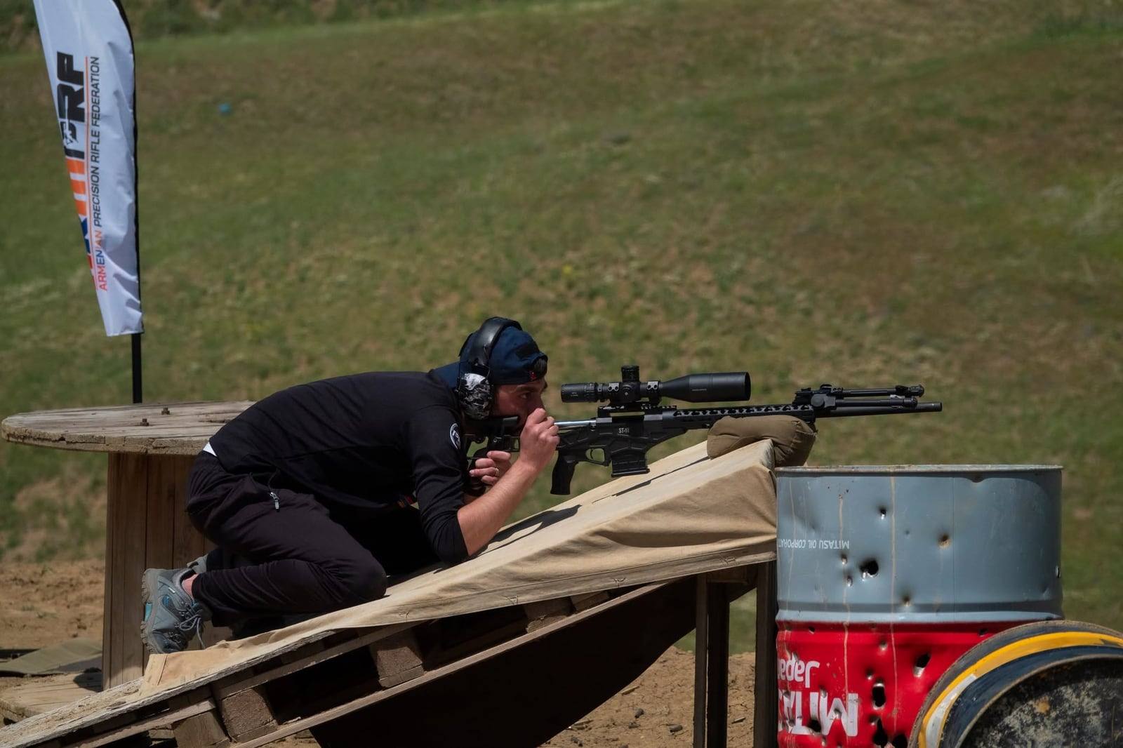 A shooter firing an ST-11 from an inclined platform
