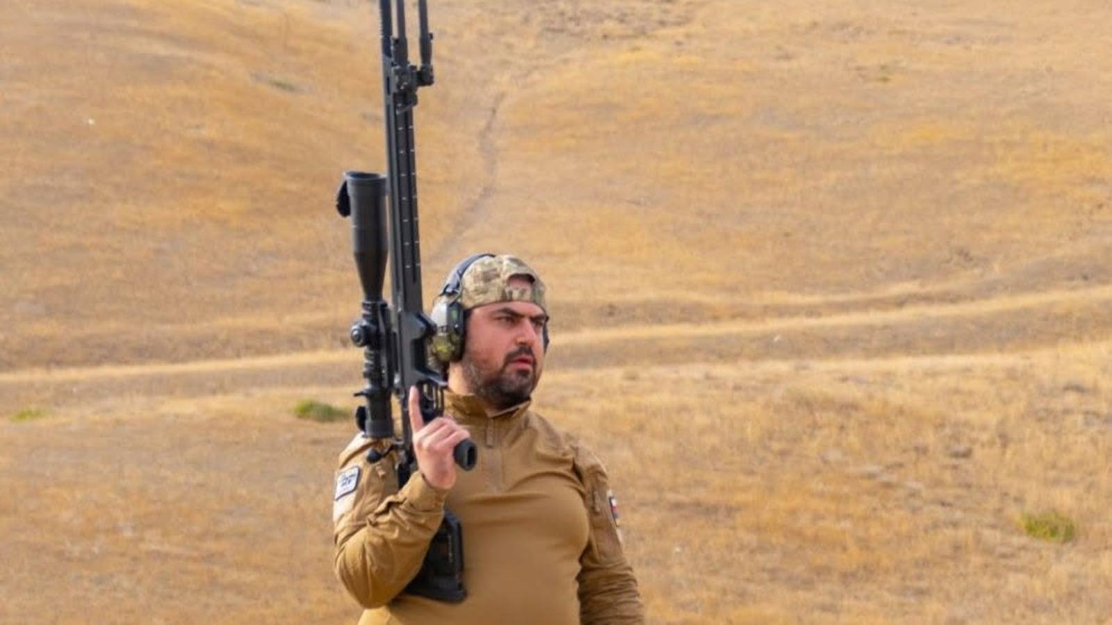 Ara Peryan at the range with a Victrix Venus rifle over his shoulder
