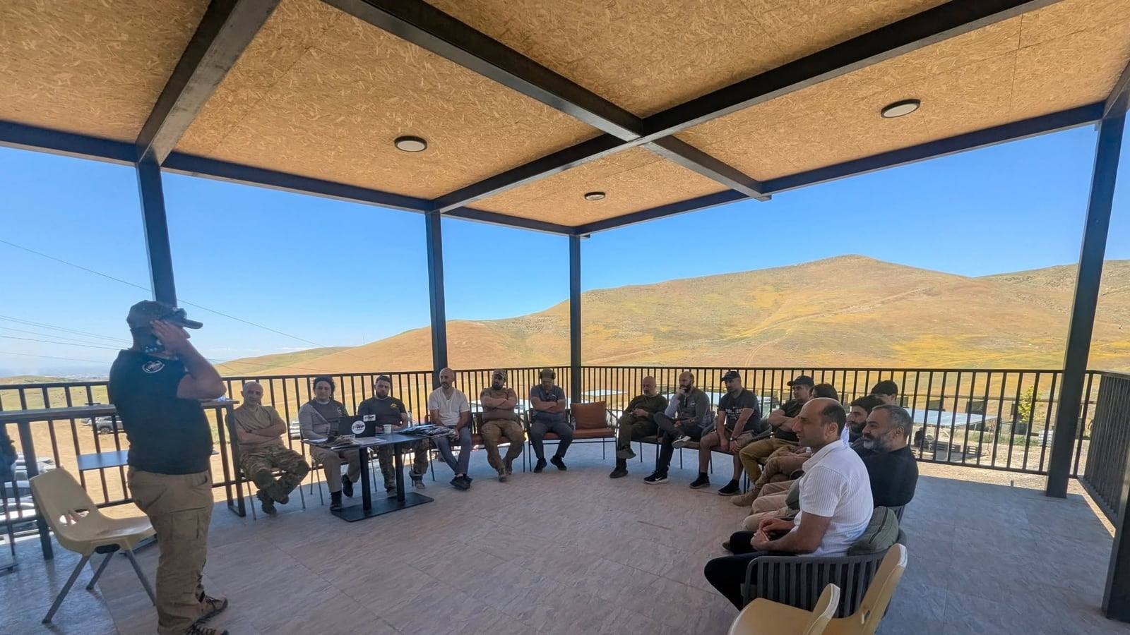 Federation members during the meeting, under the shelter at the range